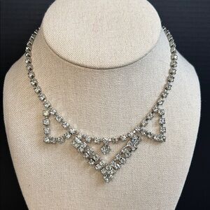 Vintage rhinestone statement necklace featuring a cascading geometric design